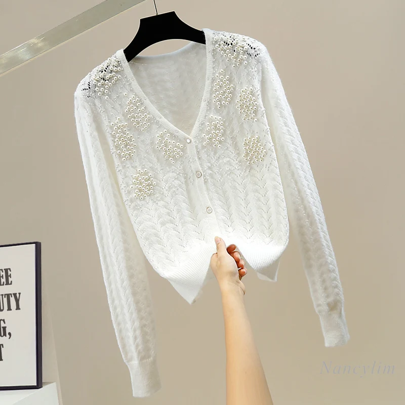 Fashion Women's Cardigan Pearl Beads V-neck Single Breasted Hollow Knitted Sweater Coat Pure Color All-Matching Temperament Top
Fashion Women's Cardigan Pearl Beads V-neck Single Breasted Hollow Knitted Sweater Coat Pure Color All-Matching Temperament Top
