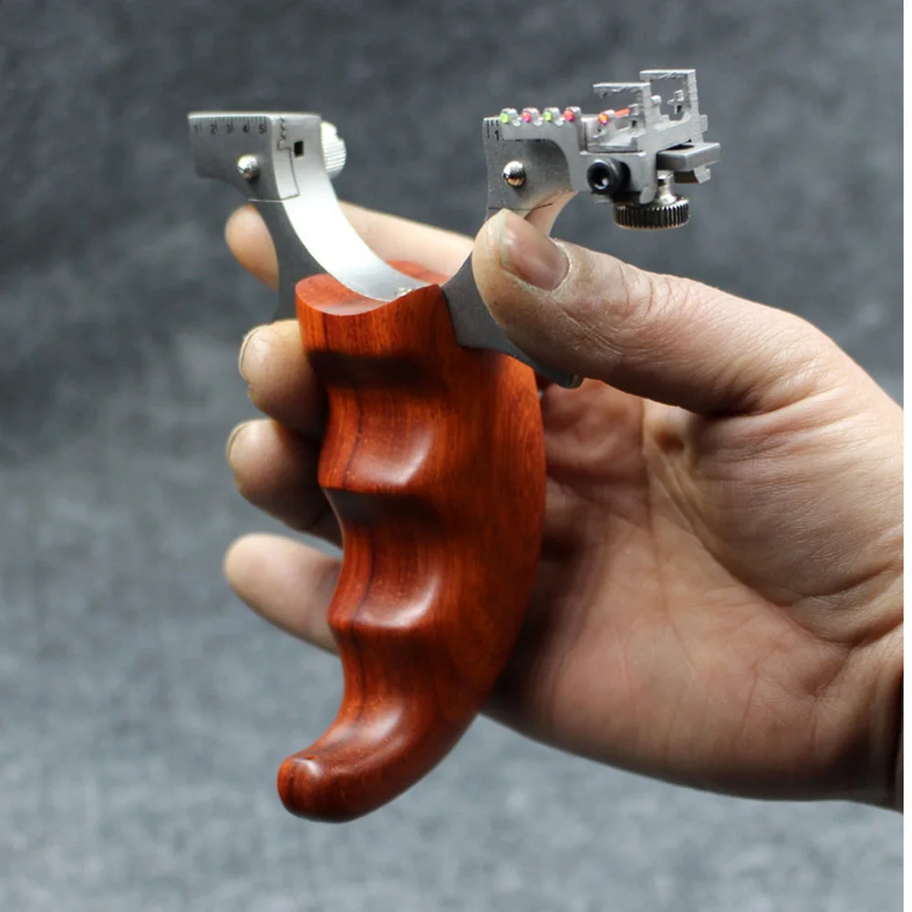 Рогатка из нержавеющей стали для охоты на открытом воздухе Рогатка с оптоволоконным прицеливанием Высококачественная Рогатка с 6 лентами 
Рогатка из нержавеющей стали для охоты на открытом воздухе Рогатка с оптоволоконным прицеливанием Высококачественная Рогатка с 6 лентами