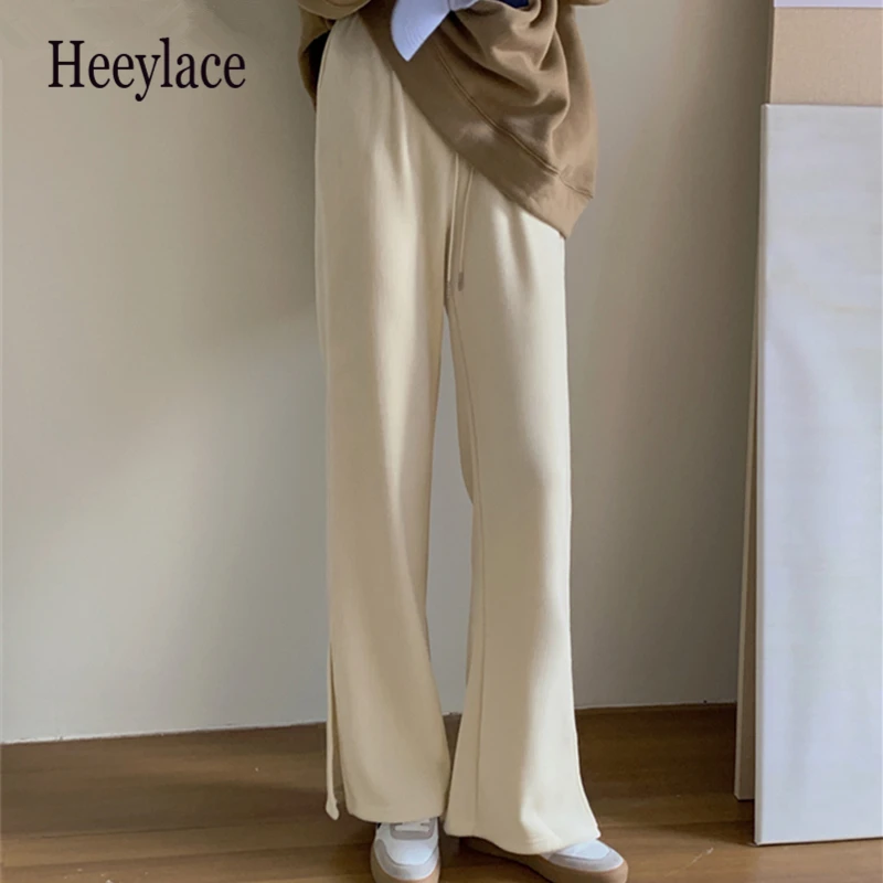 Женские брюки на весну и осень, новинка 2021, спортивные брюки с широкими штанинами и высокой талией, утепленные брюки до щиколотки с разрезом
Женские брюки на весну и осень, новинка 2021, спортивные брюки с широкими штанинами и высокой талией, утепленные брюки до щиколотки с разрезом