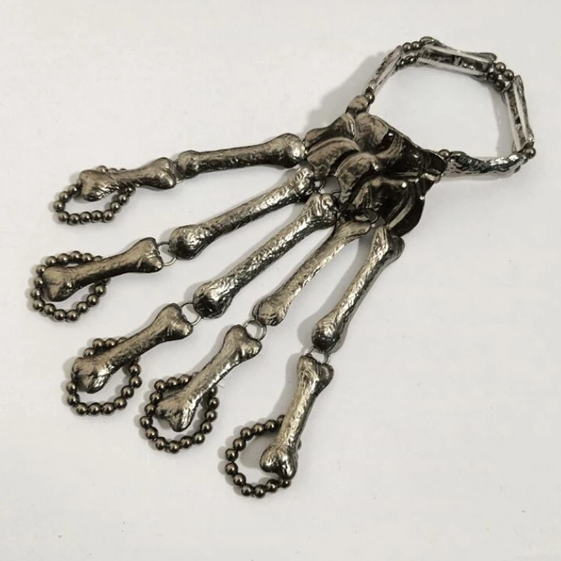 Creative Skull Bone Bracelet Gothic Punk Hand Skull Skeleton Elastic Bracelet Bangle + Rings Fashion Halloween Finger Jewelry
Creative Skull Bone Bracelet Gothic Punk Hand Skull Skeleton Elastic Bracelet Bangle + Rings Fashion Halloween Finger Jewelry