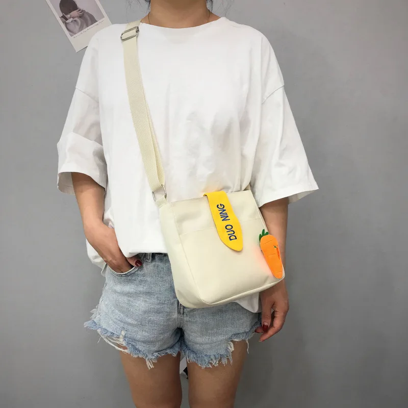 Canvas women's shoulder bag new casual radish decoration student daily small messenger bag zipper change mobile phone handbag 
Canvas women's shoulder bag new casual radish decoration student daily small messenger bag zipper change mobile phone handbag