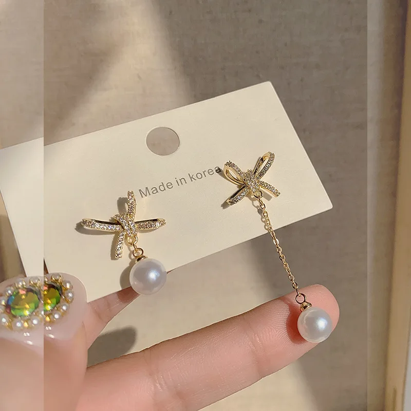 s925 silver needle micro inlaid asymmetric bow pearl earrings Korean fashion temperament net red earrings
s925 silver needle micro inlaid asymmetric bow pearl earrings Korean fashion temperament net red earrings
