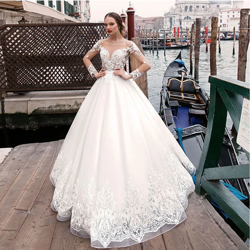 Princess A-Line White Wedding Dress O-Neck Long Sleeve Backless Lace Appliques Court Train Bridal Gowns 2021 Vestidos De Noivas
Princess A-Line White Wedding Dress O-Neck Long Sleeve Backless Lace Appliques Court Train Bridal Gowns 2021 Vestidos De Noivas
