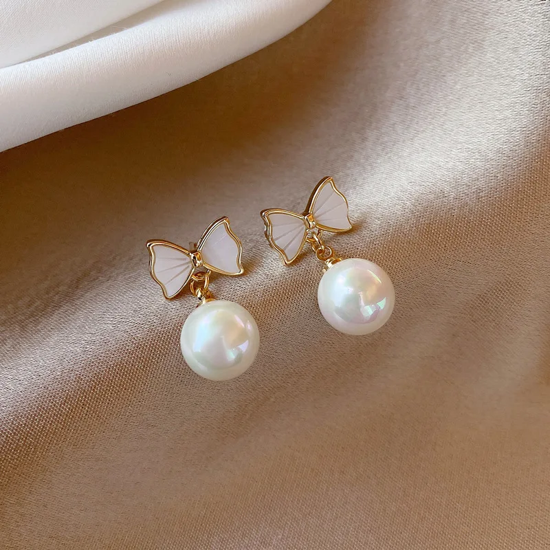 Minar Classic Simulation Pearl Dangle Earrings for Women Girls White Color Metal Cross Knotted Pendant Earrings Cute Accessories
Minar Classic Simulation Pearl Dangle Earrings for Women Girls White Color Metal Cross Knotted Pendant Earrings Cute Accessories
