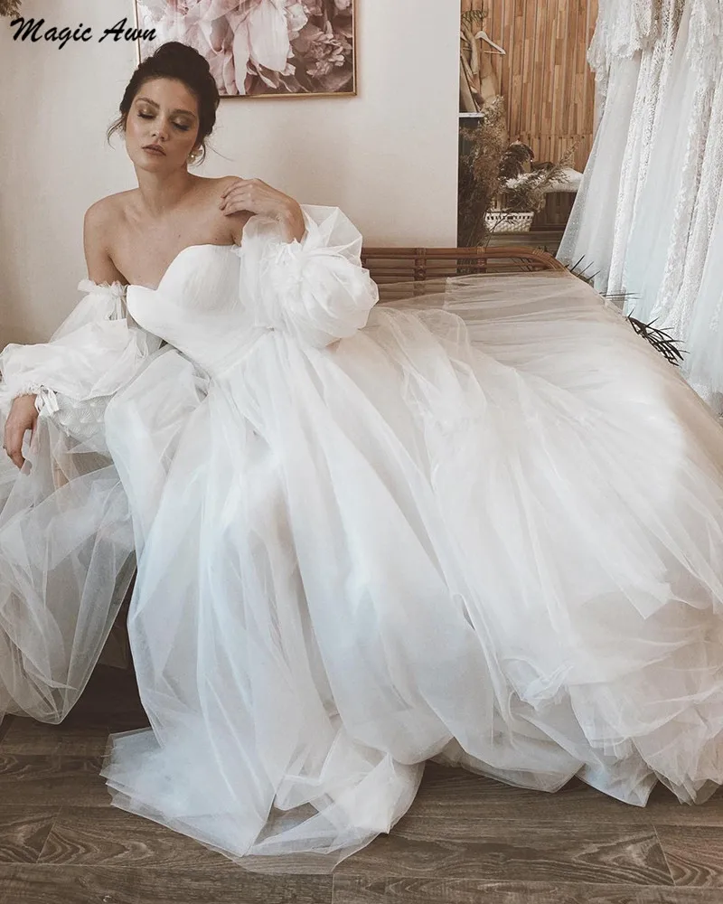 Magic Awn Graceful Boho Wedding Dresses Off The Shoulder Long Puffy Sleeves Beach Princess Bridal Gowns Country Robe De Mariée 
Magic Awn Graceful Boho Wedding Dresses Off The Shoulder Long Puffy Sleeves Beach Princess Bridal Gowns Country Robe De Mariée