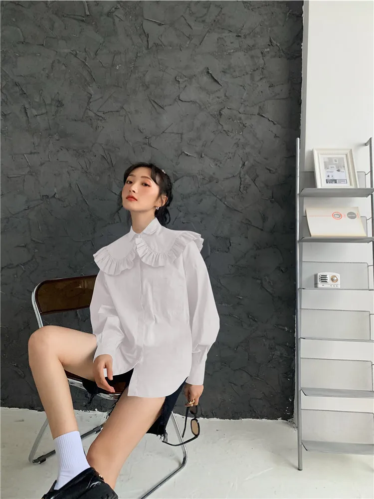 2021 Spring New Ruffled Doll Collar Shawl Long-sleeve Shirt Women's Casual Loose Single-breasted White Blouse Retro Top 
2021 Spring New Ruffled Doll Collar Shawl Long-sleeve Shirt Women's Casual Loose Single-breasted White Blouse Retro Top