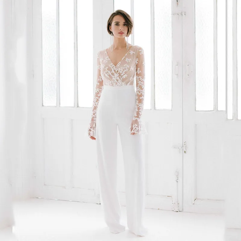 V-Neck Jumpsuit Wedding Dresses 2021 Lace Applique Flare Full Sleeves Bridal Gown New Arrival Illusion Custom Made Sexy Pantsuit
V-Neck Jumpsuit Wedding Dresses 2021 Lace Applique Flare Full Sleeves Bridal Gown New Arrival Illusion Custom Made Sexy Pantsuit