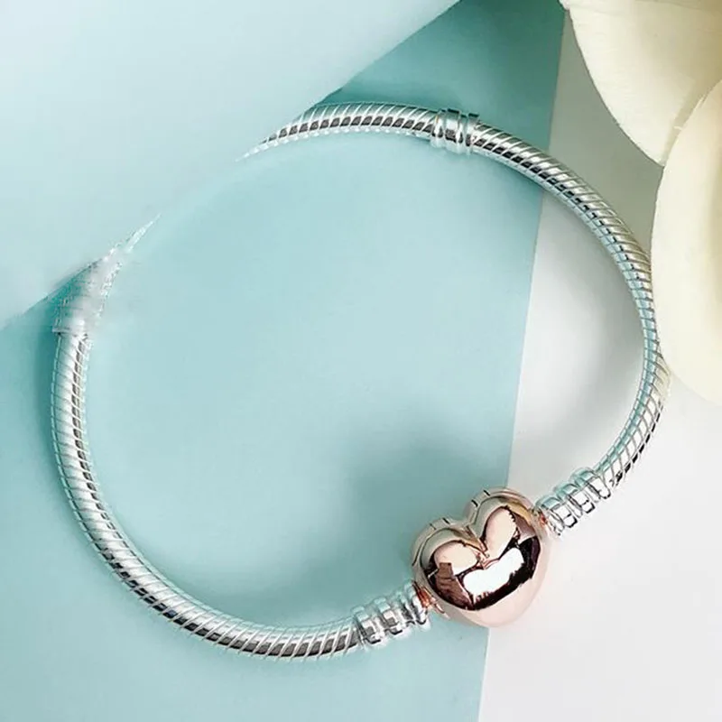 100% 925 Silver Pan Bracelet Rose Gold Heart Button Classic Pan Bracelet Fit European Charm Bracelets Women Jewelry
100% 925 Silver Pan Bracelet Rose Gold Heart Button Classic Pan Bracelet Fit European Charm Bracelets Women Jewelry
