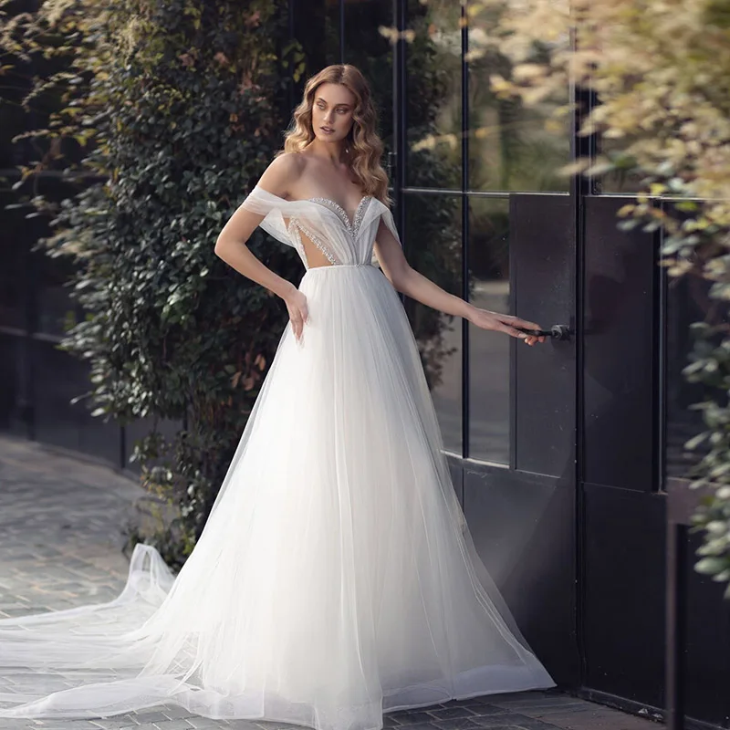 Boho Beach Off The Shoulder Wedding Dress A-Line Beaded Tulle Floor Length Bridal Gowns 2022 vestido de noiva renda
Boho Beach Off The Shoulder Wedding Dress A-Line Beaded Tulle Floor Length Bridal Gowns 2022 vestido de noiva renda