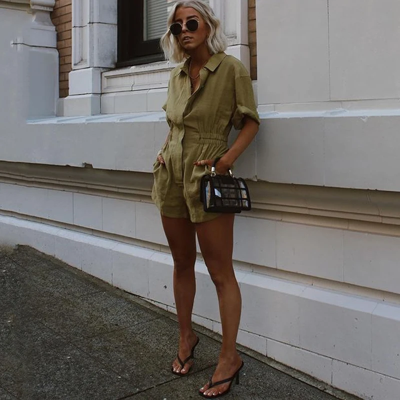Casual Green Button High Waist Women Playsuit Pocket Turn Down Short Sleeve Summer Streetwear Female Jumpsuit Fashion 2021
Casual Green Button High Waist Women Playsuit Pocket Turn Down Short Sleeve Summer Streetwear Female Jumpsuit Fashion 2021