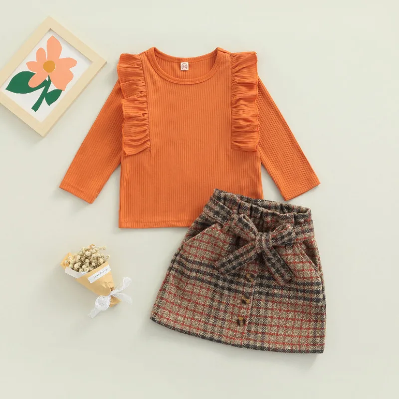 Весенняя одежда для девочек, детские топы с круглым вырезом и летающие рукава и клетчатая юбка с поясом, комплект детской одежды 
Весенняя одежда для девочек, детские топы с круглым вырезом и летающие рукава и клетчатая юбка с поясом, комплект детской одежды