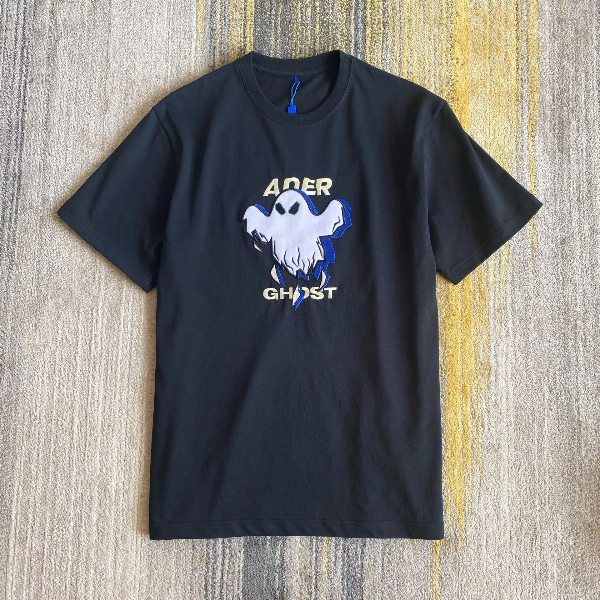 ADER Men And Women Tshirts New Anti Horsehair Affixed Cloth Embroidery Ghost Round Collar Short Sleeve T-shirt Tops Clothes
ADER Men And Women Tshirts New Anti Horsehair Affixed Cloth Embroidery Ghost Round Collar Short Sleeve T-shirt Tops Clothes