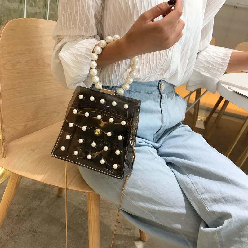 Transparent Jelly Small Bag Women's New Fashion Pearl Handbag Pvc One Shoulder Messenger Chain Small Square Bag
Transparent Jelly Small Bag Women's New Fashion Pearl Handbag Pvc One Shoulder Messenger Chain Small Square Bag