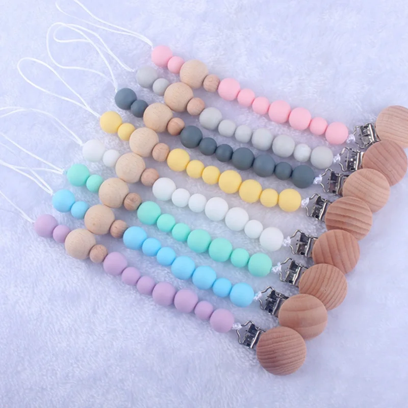 New Wooden Baby Pacifier Clip Anti-drop Infant Pacifier Chain Toy Wood Beads Nipple Holder Baby Product
New Wooden Baby Pacifier Clip Anti-drop Infant Pacifier Chain Toy Wood Beads Nipple Holder Baby Product