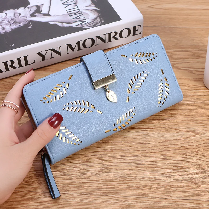 Women's long zipper wallet New Korean solid color hollow out features Pu soft wallet large capacity handbag 2021
Women's long zipper wallet New Korean solid color hollow out features Pu soft wallet large capacity handbag 2021