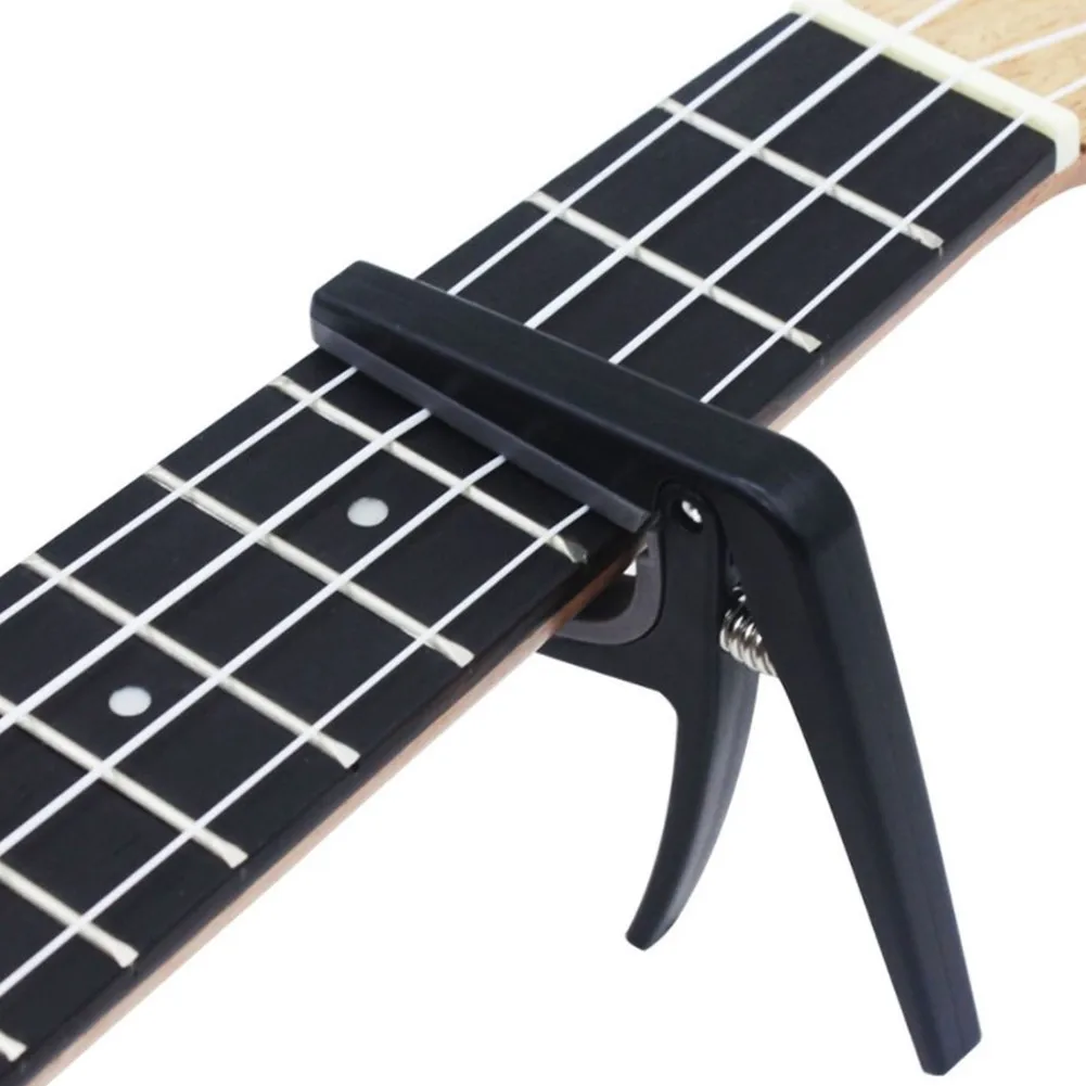 Professional Ukulele Capo 4 String Hawaii Guitar Tuning Clamp Quick Change Black 6.6x6.6x1cm Ukulele Capo Instrument Accs
Professional Ukulele Capo 4 String Hawaii Guitar Tuning Clamp Quick Change Black 6.6x6.6x1cm Ukulele Capo Instrument Accs