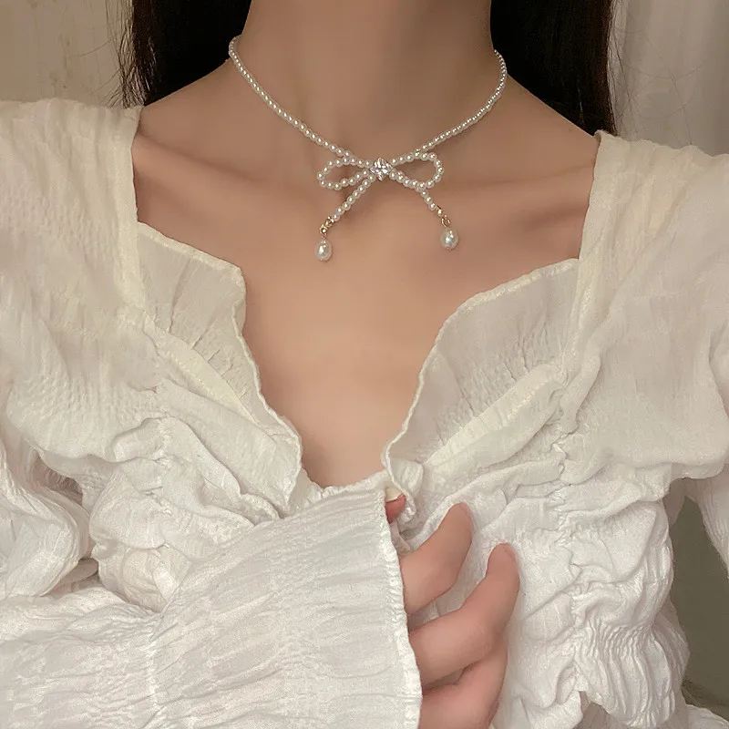 Elegant White Imitation Pearl Choker Necklace Sweet Butterfly Bowknot Pearl Wedding Necklace for Women Charm Wedding Jewelry 
Elegant White Imitation Pearl Choker Necklace Sweet Butterfly Bowknot Pearl Wedding Necklace for Women Charm Wedding Jewelry