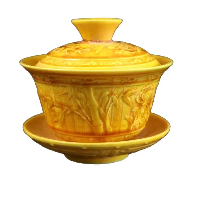 A yellow relief teacup painted with a pattern of plum orchid bamboo and chrysanthemum on Chinese porcelain
A yellow relief teacup painted with a pattern of plum orchid bamboo and chrysanthemum on Chinese porcelain