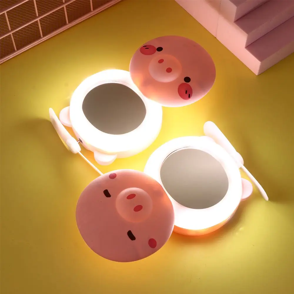 Creative LED Cartoon Pig Makeup Mirror Mini Rechargeable Vanity Mirror Light with Fan USB Portable Pocket Mirror Light Bath Tool
Creative LED Cartoon Pig Makeup Mirror Mini Rechargeable Vanity Mirror Light with Fan USB Portable Pocket Mirror Light Bath Tool
