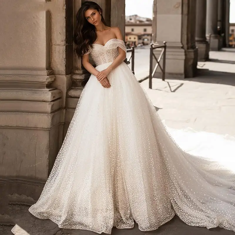 New Design Off shoulder Dot Tulle Wedding Dresses for Bridal Sexy Open Back Short Sleeve Chapel Train Bridal Gown
New Design Off shoulder Dot Tulle Wedding Dresses for Bridal Sexy Open Back Short Sleeve Chapel Train Bridal Gown