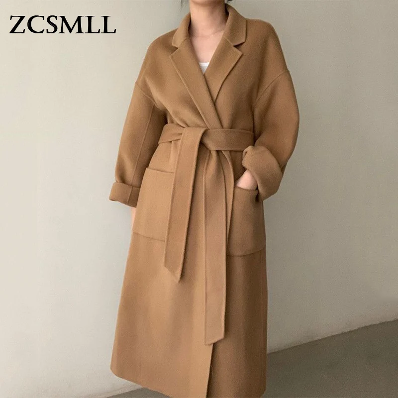 ZCSMLL Korean Chic Autumn and Winter French Vintage Windbreaker Suit Collar Double Pocket Straps Waist Knee Long Woolen Coat
ZCSMLL Korean Chic Autumn and Winter French Vintage Windbreaker Suit Collar Double Pocket Straps Waist Knee Long Woolen Coat