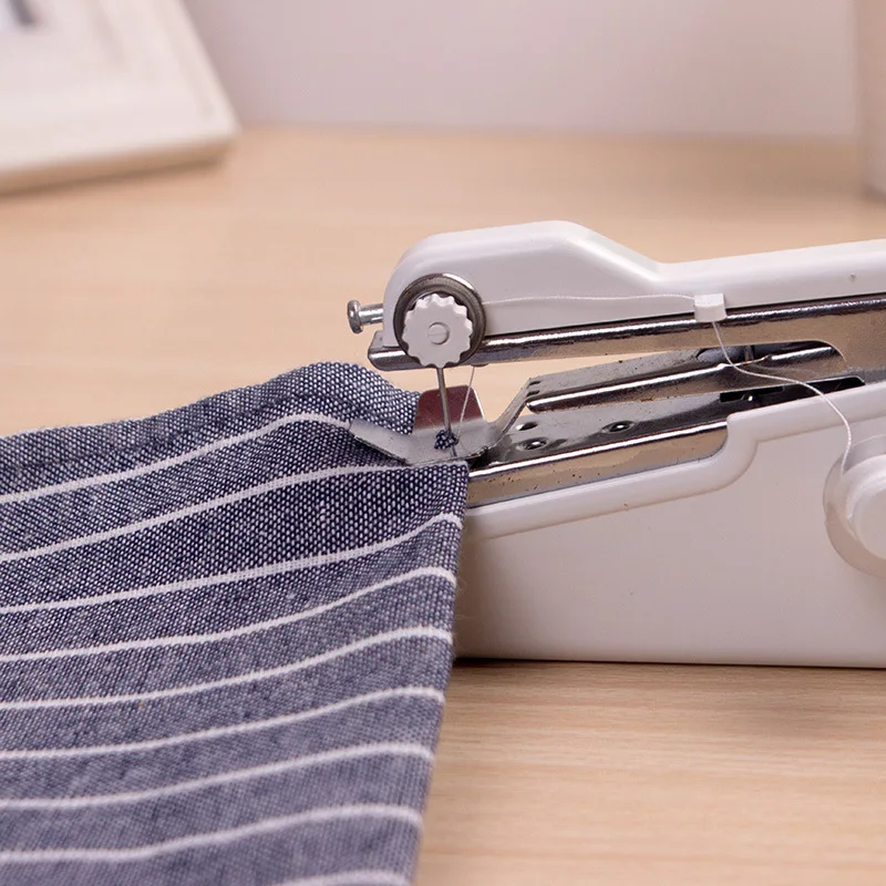 Mini Hand Sewing Machine Portable Quick Handy Stitch Sew Needlework Cordless Clothes Fabrics Household Electric Sewing Machine
Mini Hand Sewing Machine Portable Quick Handy Stitch Sew Needlework Cordless Clothes Fabrics Household Electric Sewing Machine