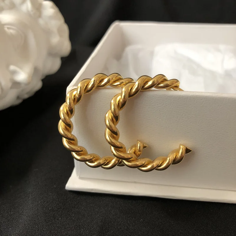Popular Non-tarnish Ladies Must-have Gold CC Earring Twisted Rope 18k Gold Plated Stainless Steel Hoop Earrings for Women 
Popular Non-tarnish Ladies Must-have Gold CC Earring Twisted Rope 18k Gold Plated Stainless Steel Hoop Earrings for Women