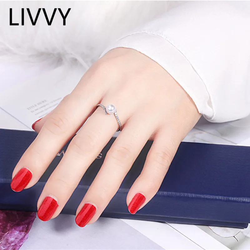 LIVVY 2021 Korean New Pearl Zircon Opening Adjustable Silver Color Ring Fashion Temperament Simple Versatile Ring Jewelry Gift 
LIVVY 2021 Korean New Pearl Zircon Opening Adjustable Silver Color Ring Fashion Temperament Simple Versatile Ring Jewelry Gift