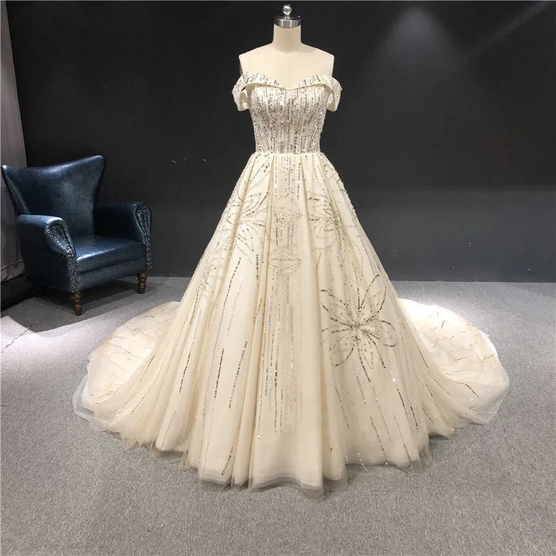 High Quality Champagne Color Heavy Beads Real Picures Boat Neck Short Sleeves Ball Gown Floor Length Long Train Wedding Dresses
High Quality Champagne Color Heavy Beads Real Picures Boat Neck Short Sleeves Ball Gown Floor Length Long Train Wedding Dresses