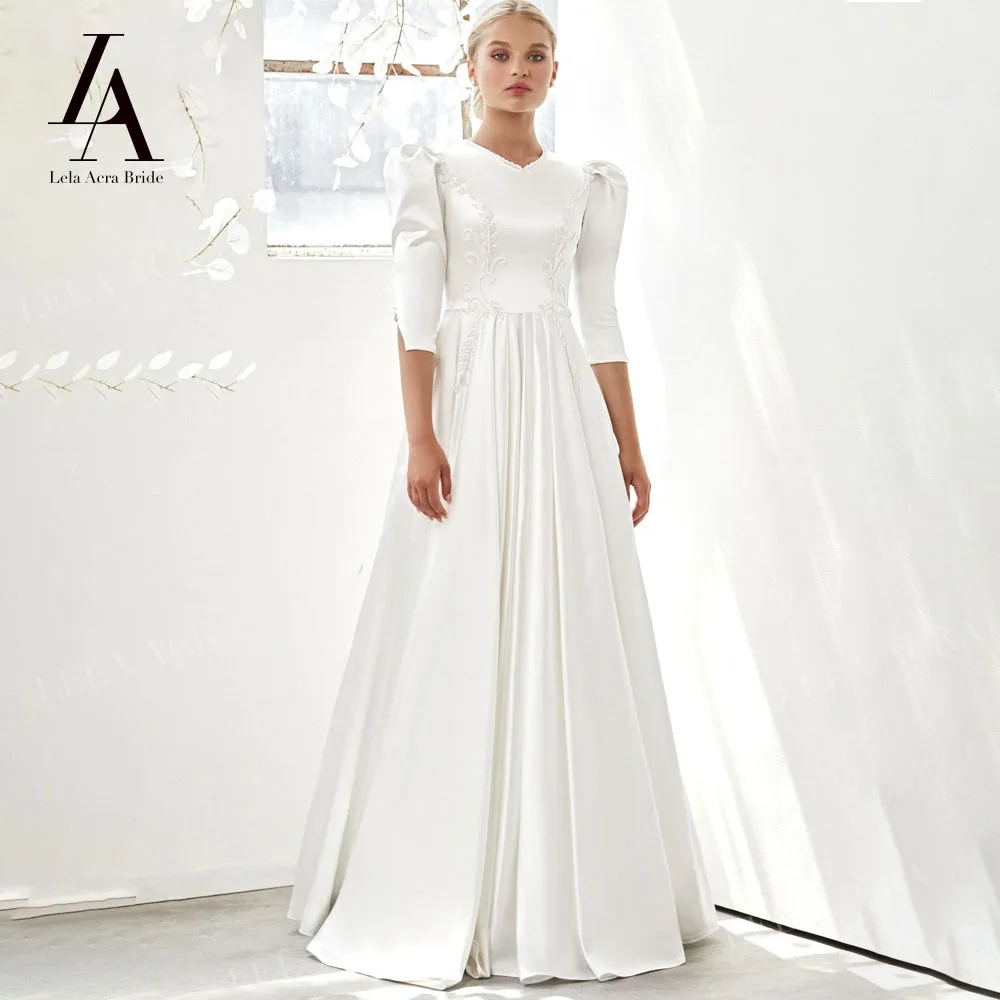 LelaAcra атласное простое свадебное платье 2022 с рукавом до локтя, круглым вырезом, бисером, трапециевидной формы, искусственная кожа, AV13, Vestido de Noiva 
LelaAcra атласное простое свадебное платье 2022 с рукавом до локтя, круглым вырезом, бисером, трапециевидной формы, искусственная кожа, AV13, Vestido de Noiva