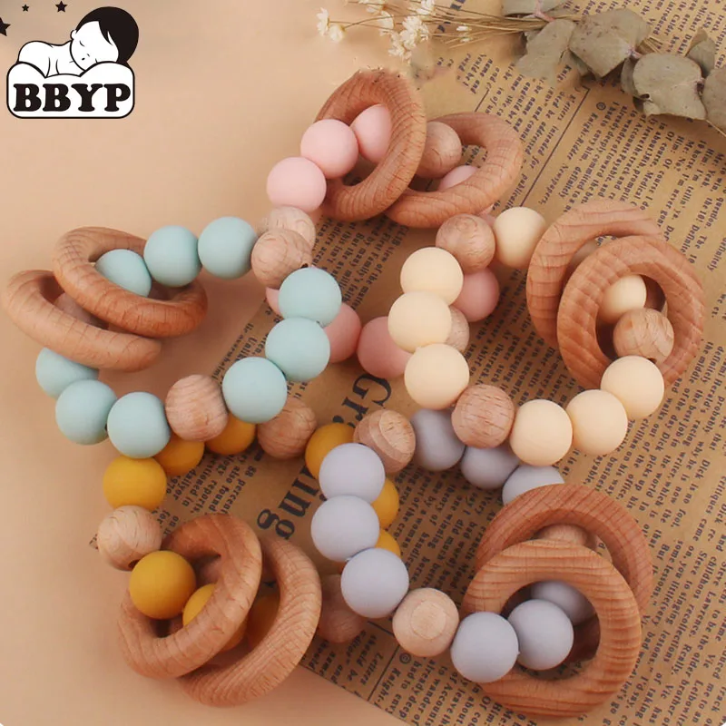 Teething Wood Rattles Toys Baby Nursing Bracelets Silicone Teether Baby Teether Bracelets Nursing Toys Gift
Teething Wood Rattles Toys Baby Nursing Bracelets Silicone Teether Baby Teether Bracelets Nursing Toys Gift