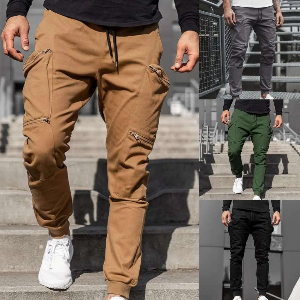 Men's Pants Multi Zipper Pockets Solid Color Training Trousers Ankle Tied Mid Waist Harem Loose Cargo Pants for Outdoor Sports
Men's Pants Multi Zipper Pockets Solid Color Training Trousers Ankle Tied Mid Waist Harem Loose Cargo Pants for Outdoor Sports