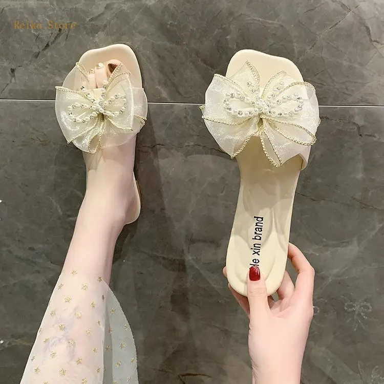 Fairy Style Bowknot Rhinestone Beaded Slippers for Women 2021 New Summer Matching Skirt Beach Shoes for Seaside Vacation
Fairy Style Bowknot Rhinestone Beaded Slippers for Women 2021 New Summer Matching Skirt Beach Shoes for Seaside Vacation