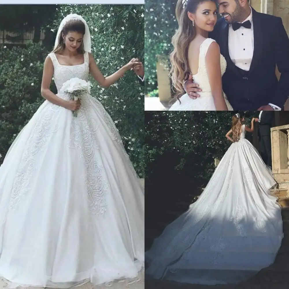 2020 Saudi Arabia Ball Gown Wedding Dress Square Neck Lace Appliques Crystal Beaded Plus Size Chapel Train Open Back Bridal Gown
2020 Saudi Arabia Ball Gown Wedding Dress Square Neck Lace Appliques Crystal Beaded Plus Size Chapel Train Open Back Bridal Gown