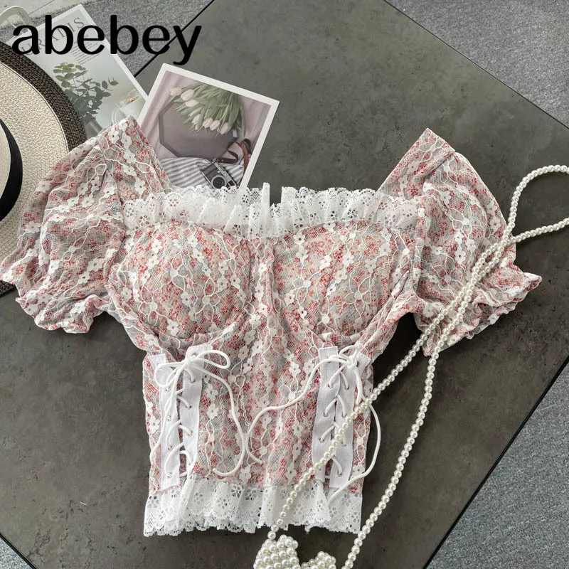 Design Hollow Backless Blouse Women Korean Square Collar Lace Up White Tops Summer Fashion Streetwear Short Blouse
Design Hollow Backless Blouse Women Korean Square Collar Lace Up White Tops Summer Fashion Streetwear Short Blouse
