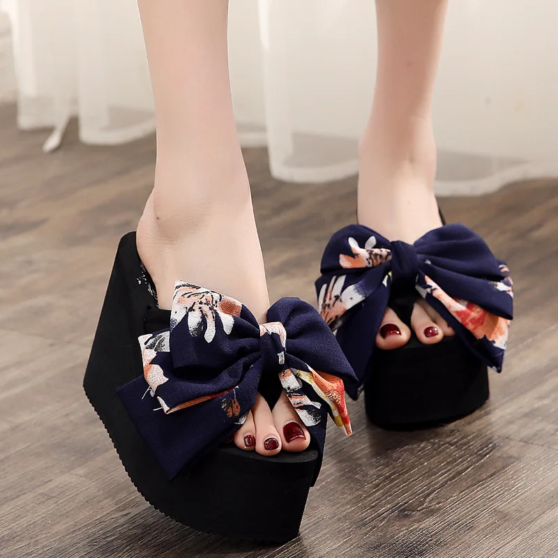 Ladies' New Summer Super High Bowknot Flip-flops Women's Large Size Sponge Cake Thick-soled Anti-skid Sandals Wedge Sandals
Ladies' New Summer Super High Bowknot Flip-flops Women's Large Size Sponge Cake Thick-soled Anti-skid Sandals Wedge Sandals