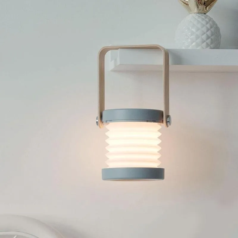 Foldable Portable Lantern Lamp Light With Wooden Handle 25 Lamp Beads Multifunctional Small Table Lamp
Foldable Portable Lantern Lamp Light With Wooden Handle 25 Lamp Beads Multifunctional Small Table Lamp