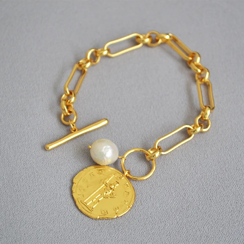 Europe and America retro gold coin irregular baroque pearl chain cold light wind exaggeration OT clasp chain girl bracelet
Europe and America retro gold coin irregular baroque pearl chain cold light wind exaggeration OT clasp chain girl bracelet
