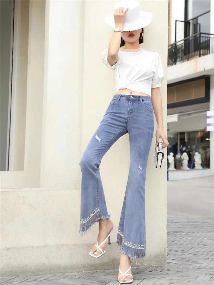 2021 spring and summer new ladies beaded diamond chain tassel jeans heavy industry washed high waist flared pants long pants
2021 spring and summer new ladies beaded diamond chain tassel jeans heavy industry washed high waist flared pants long pants