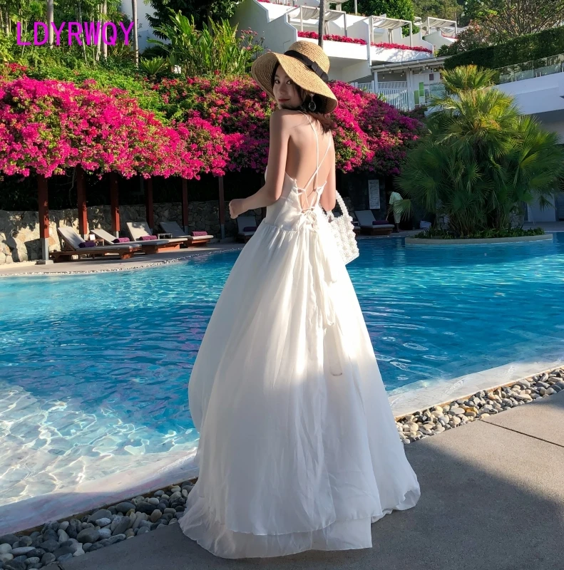 LDYRWQY 2021 Summer New Korean Fashion Temperament White Sling Sexy Round Neck Leaky Back Beach Dress Polyester
LDYRWQY 2021 Summer New Korean Fashion Temperament White Sling Sexy Round Neck Leaky Back Beach Dress Polyester
