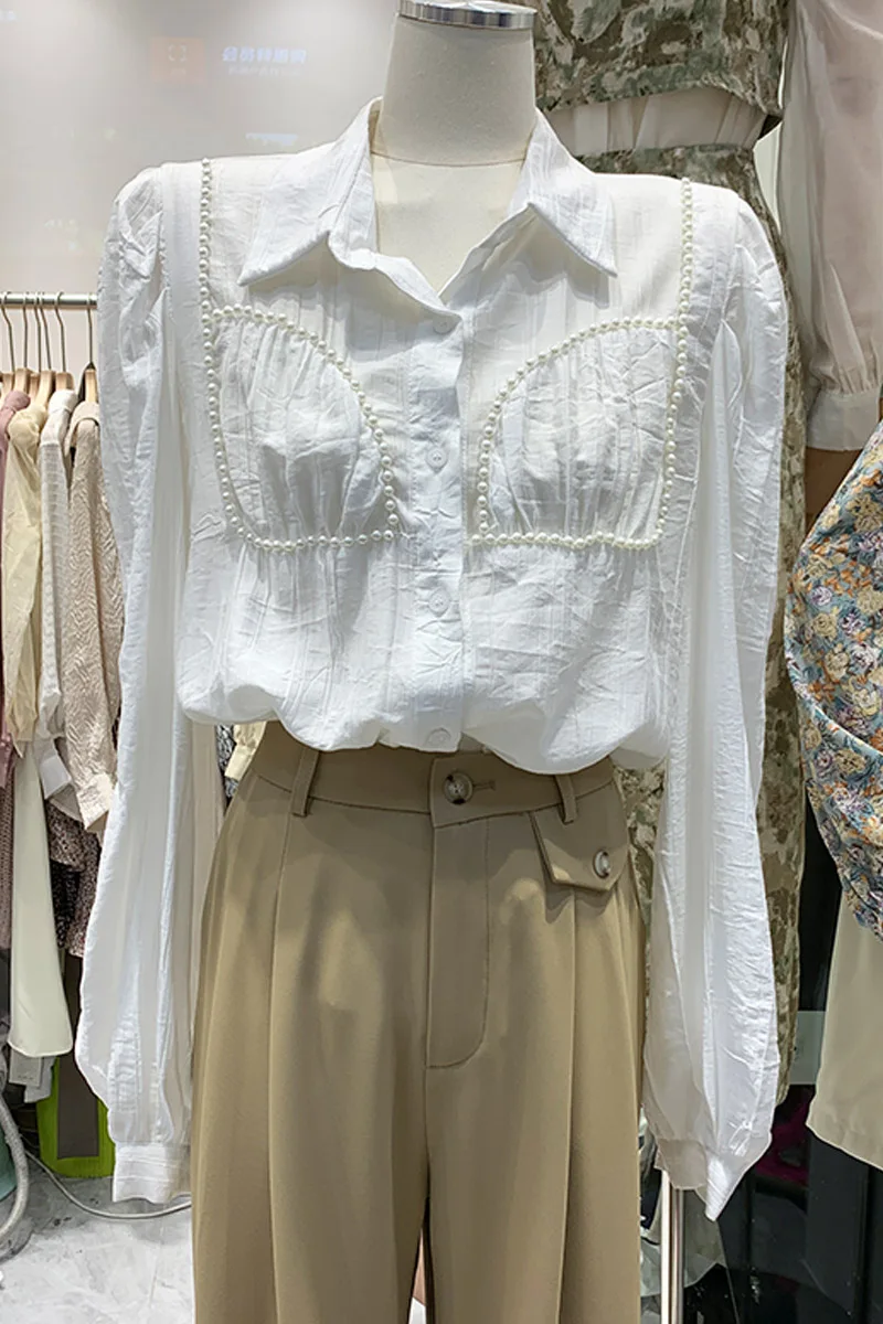 2021 Spring and Autumn New Beaded White Bubble Long Sleeve Shirt Women's Loose Shirt Top Blouse 
2021 Spring and Autumn New Beaded White Bubble Long Sleeve Shirt Women's Loose Shirt Top Blouse