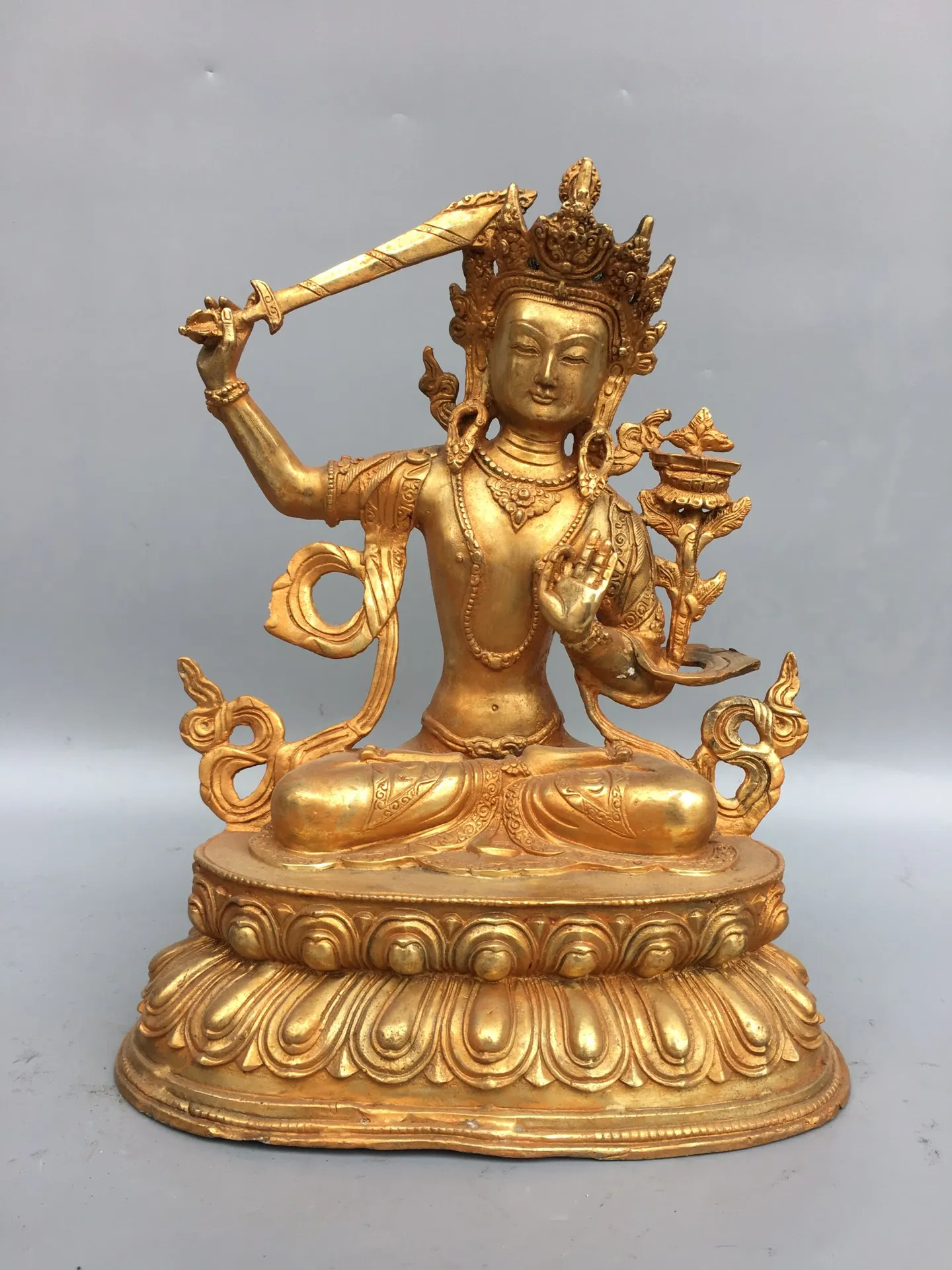12"Chinese Folk Collection Old Bronze Gilt Patina Manjushri Lotus Terrace Sitting Buddha Ornaments Town House Exorcism
12"Chinese Folk Collection Old Bronze Gilt Patina Manjushri Lotus Terrace Sitting Buddha Ornaments Town House Exorcism