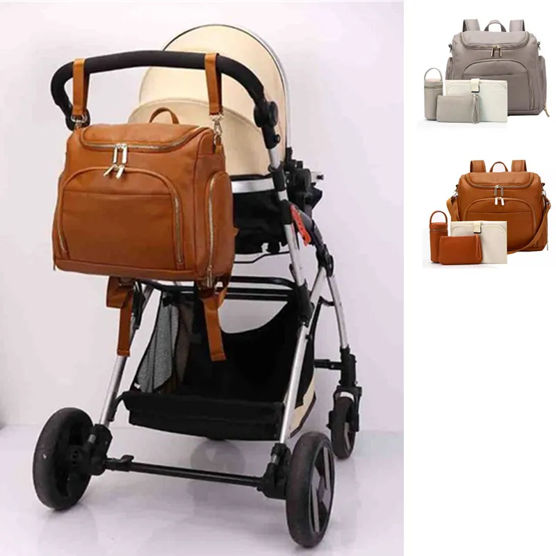 Сумка для детских подгузников из искусственной кожи, рюкзак для беременных, пеленальный коврик, лямки для коляски, изоляционная сумка с косметичкой
Сумка для детских подгузников из искусственной кожи, рюкзак для беременных, пеленальный коврик, лямки для коляски, изоляционная сумка с косметичкой