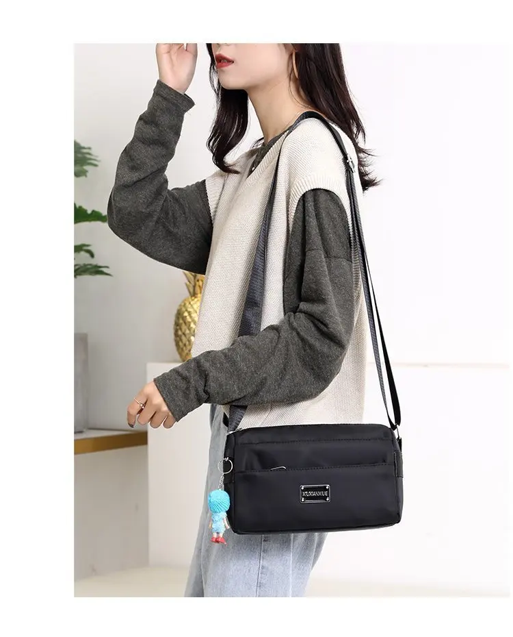 2021 Women's Bag Fashion Slung Waterproof Nylon Bag Doll Pendant Twill Cloth Three Pull Multi Purpose Mommy One Shoulder Bag
2021 Women's Bag Fashion Slung Waterproof Nylon Bag Doll Pendant Twill Cloth Three Pull Multi Purpose Mommy One Shoulder Bag