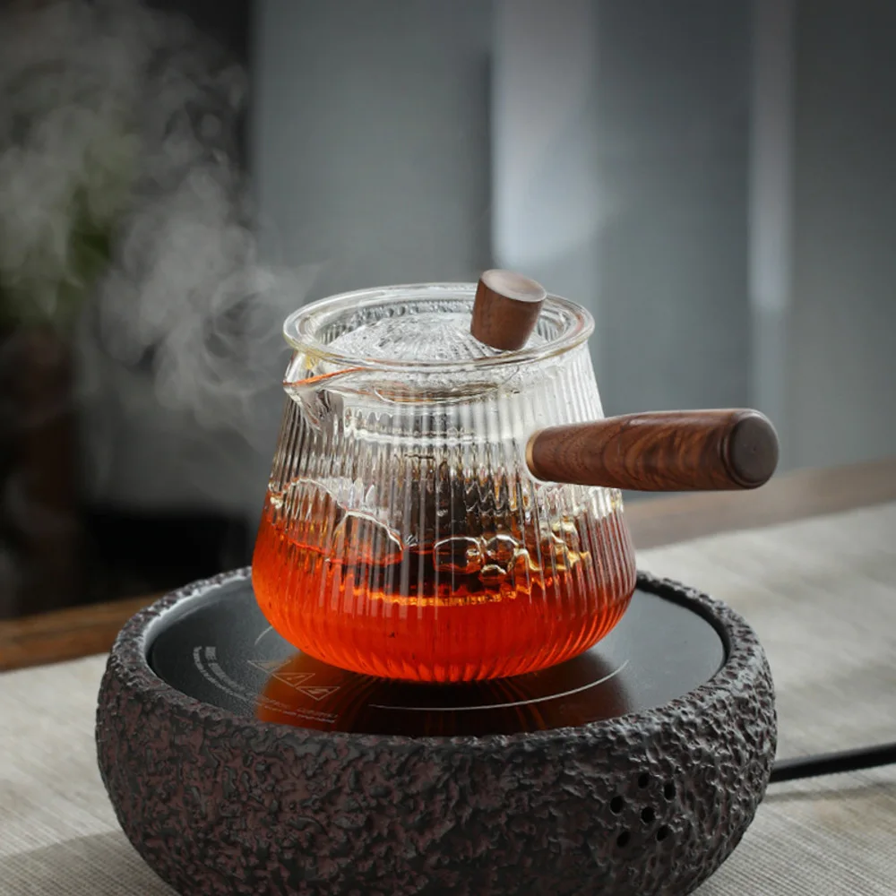 New wooden handle glass teapot heat resistant side handle tea cooker thickened household filter pot single pot office flower tea 
New wooden handle glass teapot heat resistant side handle tea cooker thickened household filter pot single pot office flower tea