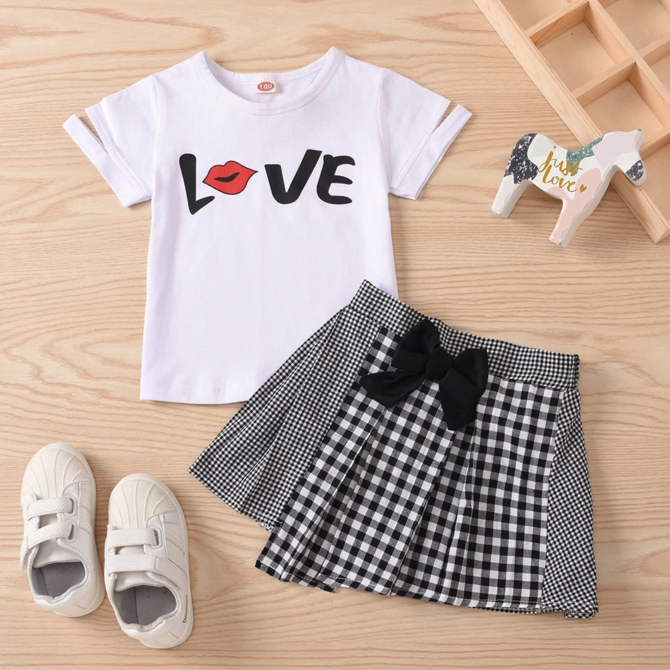 Girls Clothing Summer Short Sleeve Two Color Lettered Print T-Shirt Black White Lattice Bow Irregular Pleated Skirt Kids Suit
Girls Clothing Summer Short Sleeve Two Color Lettered Print T-Shirt Black White Lattice Bow Irregular Pleated Skirt Kids Suit