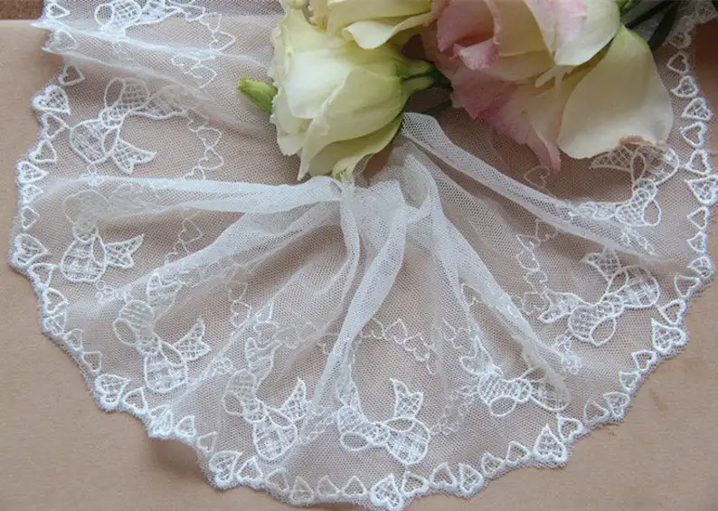 Off White Tulle Mesh Lace Trim With Bowknot And Little Heart Embroidered 3.9” Wide 2 Yards Long
Off White Tulle Mesh Lace Trim With Bowknot And Little Heart Embroidered 3.9” Wide 2 Yards Long