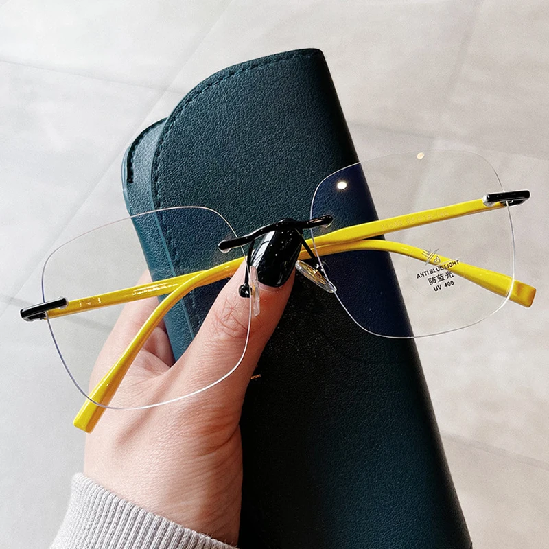 New Fashion Anti-blue Light Rimless Square Eyeglasses For Women Vintage Pink Yellow Computer Clear Glasses Frame Female Shades
New Fashion Anti-blue Light Rimless Square Eyeglasses For Women Vintage Pink Yellow Computer Clear Glasses Frame Female Shades