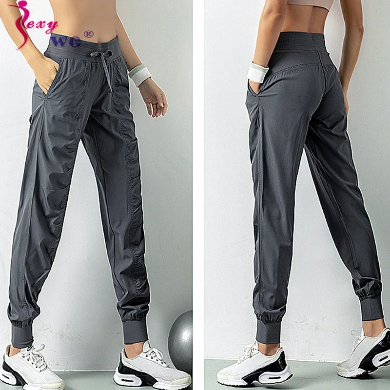 

Женские Леггинсы для йоги и бега SEXYWG большого размера, повседневные быстросохнущие брюки, длинные леггинсы для фитнеса и спортзала с карман...