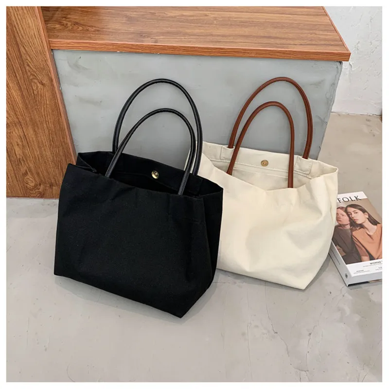 New luxury ladies large canvas bag simple black and white large capacity snap button shoulder bag travel shopping female handbag
New luxury ladies large canvas bag simple black and white large capacity snap button shoulder bag travel shopping female handbag